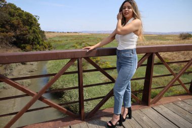 Photo of beautiful lady in a park on a summer day