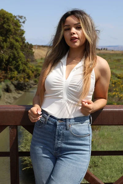Photo of beautiful lady in a park on a summer day