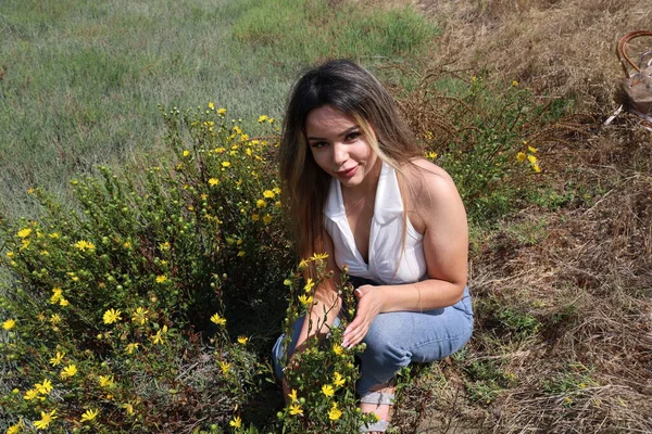 Photo of beautiful lady in a park on a summer day