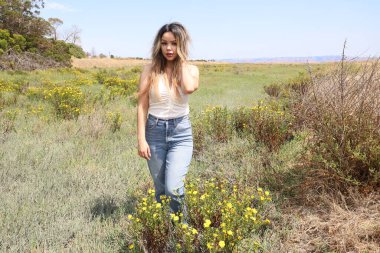 Photo of beautiful lady in a park on a summer day
