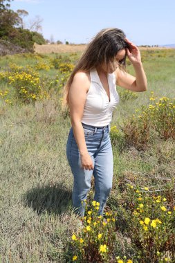 Photo of beautiful lady in a park on a summer day