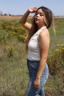 Photo of beautiful lady in a park on a summer day