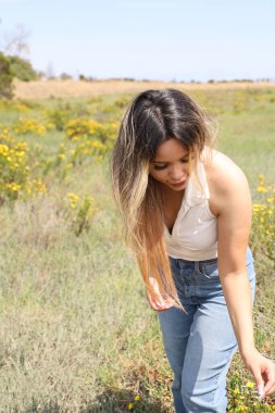 Photo of beautiful lady in a park on a summer day
