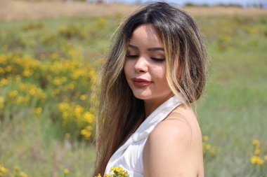 Photo of beautiful lady in a park on a summer day