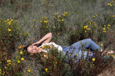 Photo of beautiful lady in a park on a summer day
