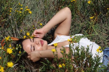 Photo of beautiful lady in a park on a summer day