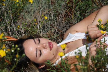 Photo of beautiful lady in a park on a summer day