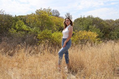 Photo of beautiful lady in a park on a summer day