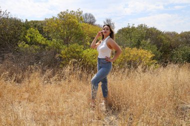 Photo of beautiful lady in a park on a summer day