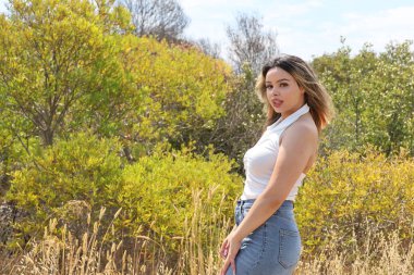 Photo of beautiful lady in a park on a summer day