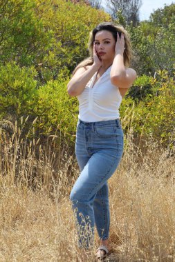 Photo of beautiful lady in a park on a summer day