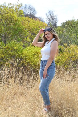 Photo of beautiful lady in a park on a summer day