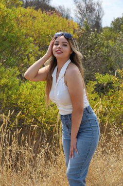 Photo of beautiful lady in a park on a summer day