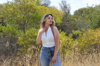 Photo of beautiful lady in a park on a summer day