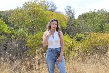 Photo of beautiful lady in a park on a summer day