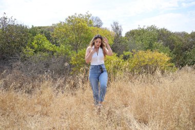 Photo of beautiful lady in a park on a summer day