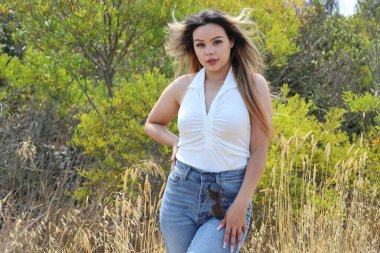 Photo of beautiful lady in a park on a summer day