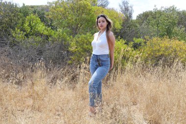 Photo of beautiful lady in a park on a summer day