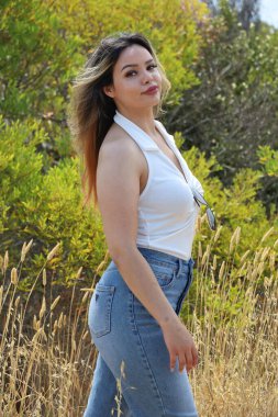 Photo of beautiful lady in a park on a summer day