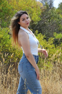Photo of beautiful lady in a park on a summer day