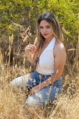 Photo of beautiful lady in a park on a summer day