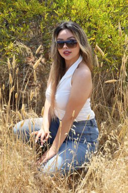 Photo of beautiful lady in a park on a summer day