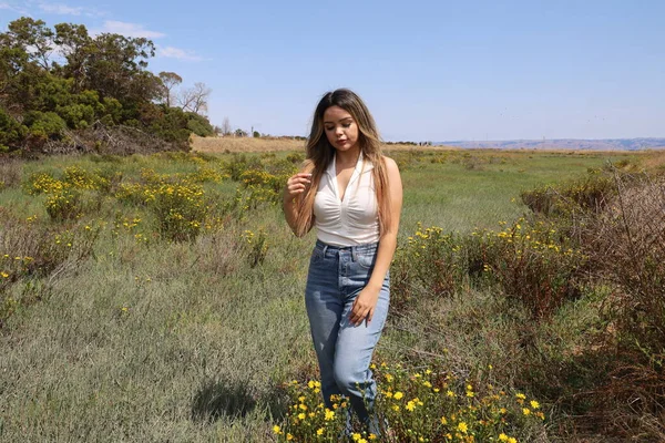 Photo of beautiful lady in a park on a summer day