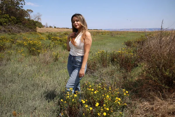 Photo of beautiful lady in a park on a summer day