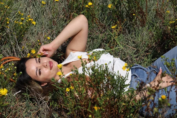 Photo of beautiful lady in a park on a summer day