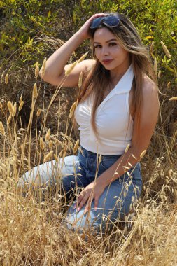 Photo of beautiful lady in a park on a summer day