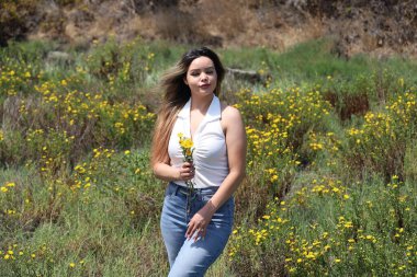 Photo of beautiful lady in a park on a summer day