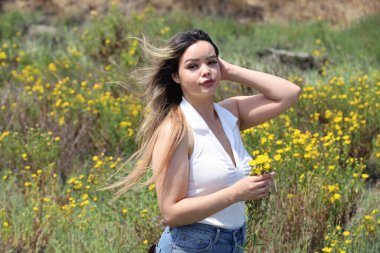 Photo of beautiful lady in a park on a summer day