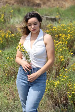 Photo of beautiful lady in a park on a summer day