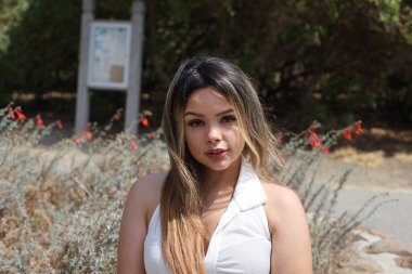 Photo of beautiful lady in a park on a summer day