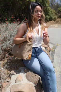 Photo of beautiful lady in a park on a summer day