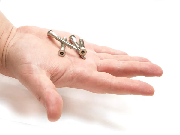 Four bolts on a human hand — Stock Photo, Image