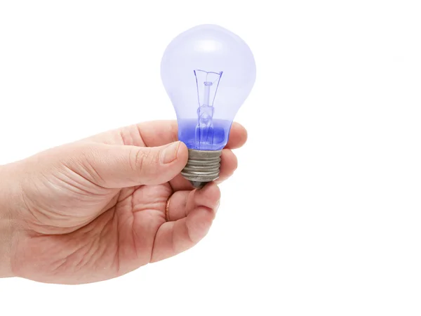 Blue lamp lying on the human hand — Stock Photo, Image