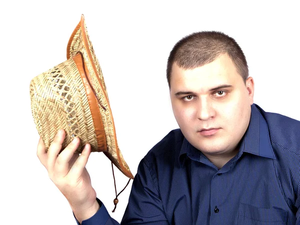 Young man in a blue shirt with a straw hat in hand — Stock Photo, Image