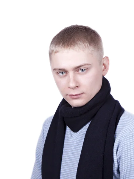 Young man in a blue sweater and a black scarf — Stock Photo, Image