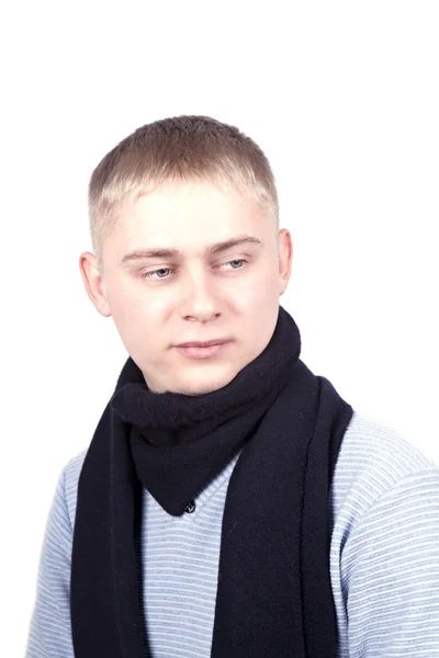 Young man in a blue sweater and a black scarf — Stock Photo, Image