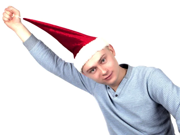 Young man in a Santa Claus hat and a blue sweater — Stock Photo, Image