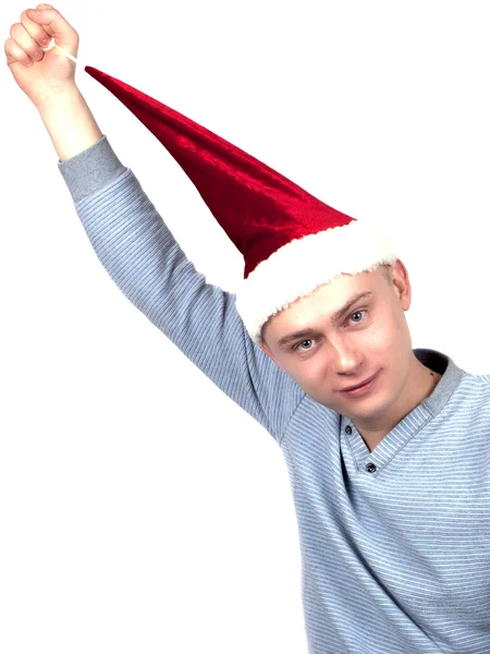 Young man in a Santa Claus hat and a blue sweater — Stock Photo, Image