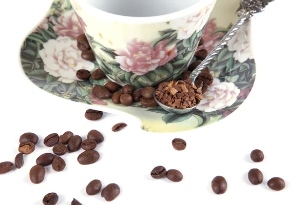 Composition of coffee beans, cups and spoons — Stock Photo, Image