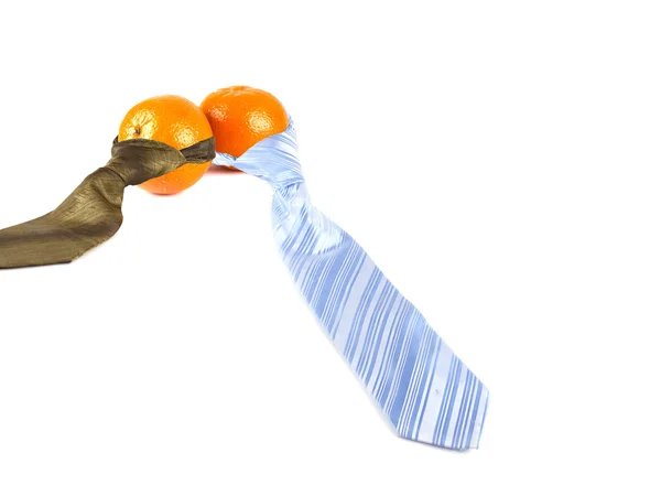 Composition of two tangerines and two ties — Stock Photo, Image