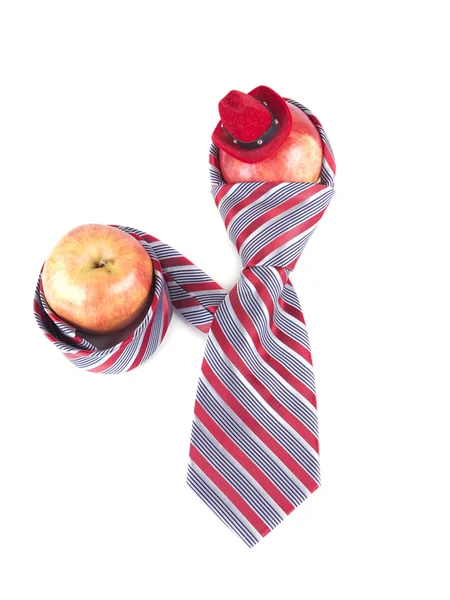 Composition of apple, red tie and a hat — Stock Photo, Image