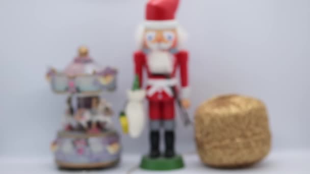 Santa Claus nutcracker Christmas decorations closeup on white background — Stock Video