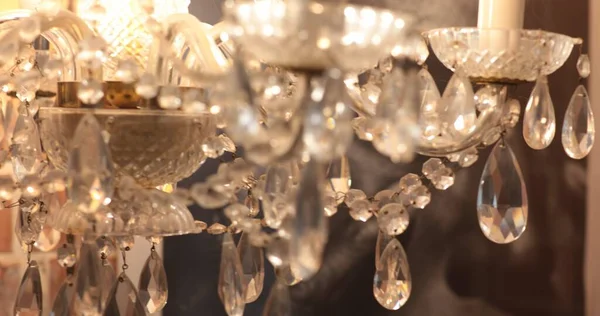 Shiny elegant chandelier with diamond shaped crystal pendants look like jewelry — Stock Photo, Image