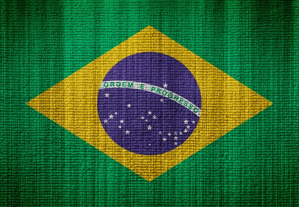 Brasilien flagga på en tyg textur — Stockfoto