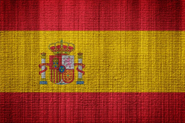 Bandera de España sobre una textura de tela —  Fotos de Stock