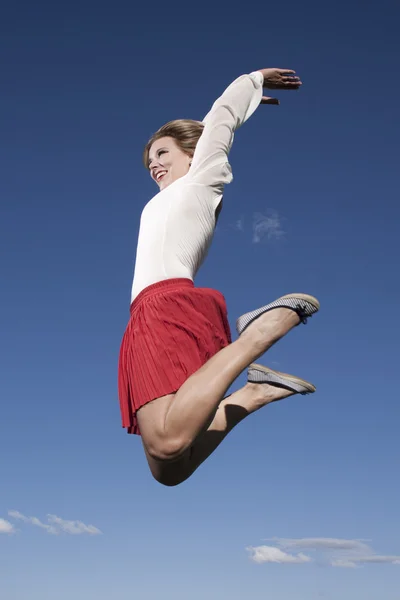 Lucky jumping woman — Stock Photo, Image